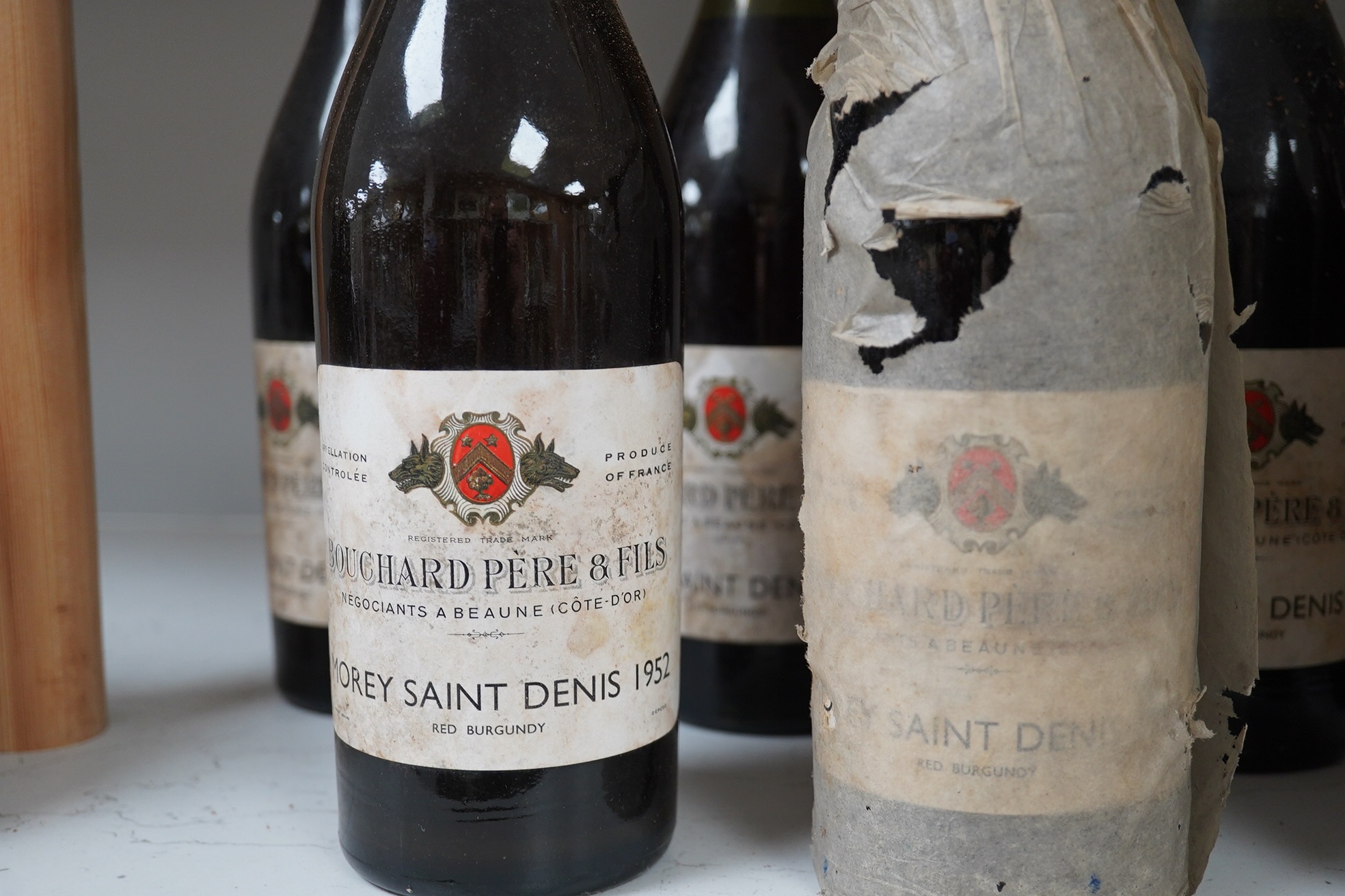 Twelve bottles of 1952 Bouchard Pere & Fils Morey Saint Denis red burgundy. Condition - fair to good, storage history unknown